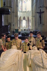 France, Allier (03), former province of Bourbonnais, Souvigny, the cluniac priory church of Saints Peter and Paul (prieuré Saint-Pierre-et-Saint-Paul), ducal necropolis of the Dukes of Bourbon, scouts of Europe around the recumbent statues of two illustrious abbots of Cluny who became Saint Mayeul and Saint Odilon
