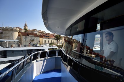 Croatia, Dalmatia, Dalmatian coast, Korcula Island, Korcula Town, arrival at the port of cruise ship Ave Maria, its captain Rade Naranca in the wheelhouse