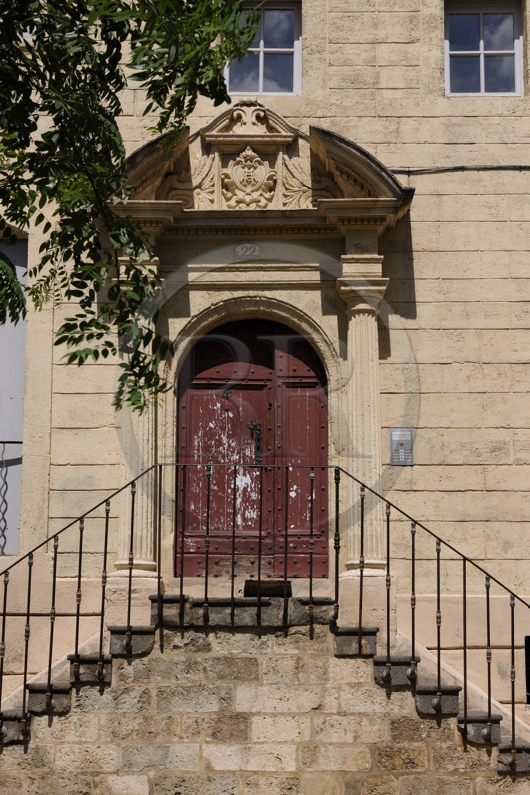 France, Herault, Pezenas, Hotel of Bezons from the 17th century cours (street) Jean Jaures, door surrounded by columns with entablature and pediment cut