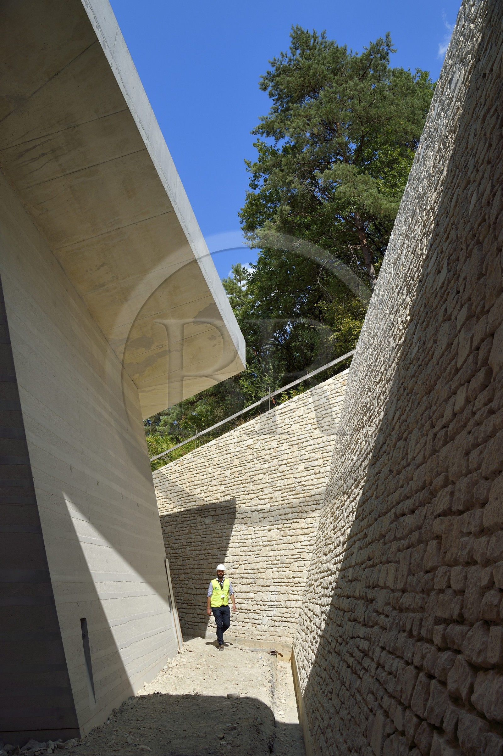 France, Dordogne, Montignac, Montignac-Lascaux Parietal Art international Centre (Lascaux 4) building site designed by the Norwegian architectural agency Snøhetta, access to the reconstitution of the cave by a long sloping trench at the edge of forest and made of concrete and local stones