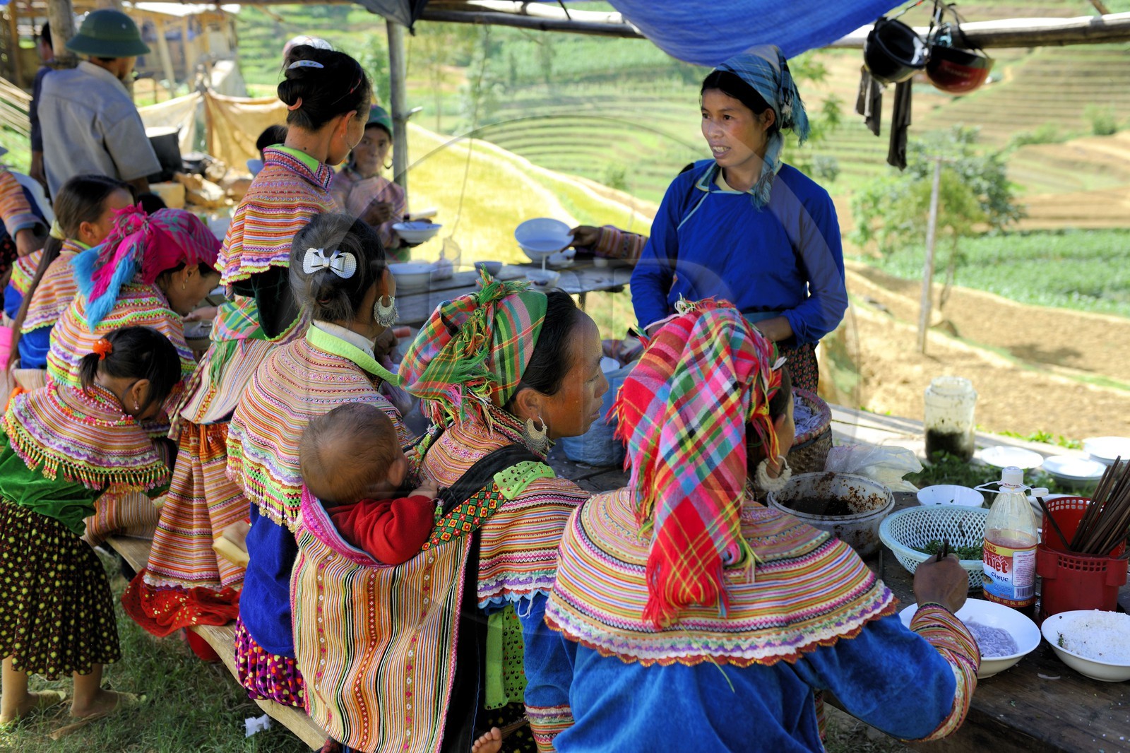 Vietnam, Lao Cai province, Bac Ha district, Can Cau market, women from the Flower Hmong minority at the restaurant