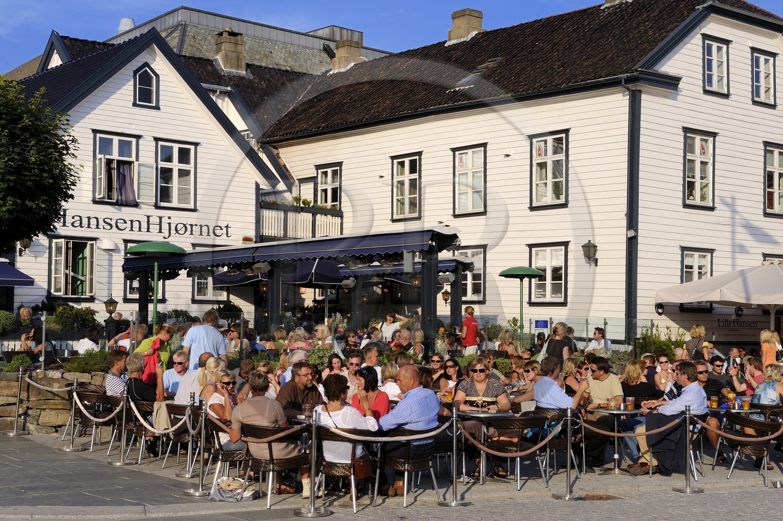 Norway, Rogaland County, Stavanger, cafe terrace in the old harbour (Vagen)