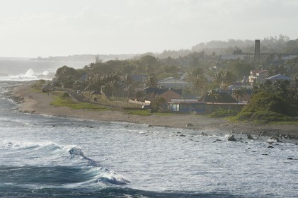 France, Reunion island (French overseas department), Petite-Ile on the southern coast, Grand-Bois beach and rocks, the chimney of the old sugar factory in the background