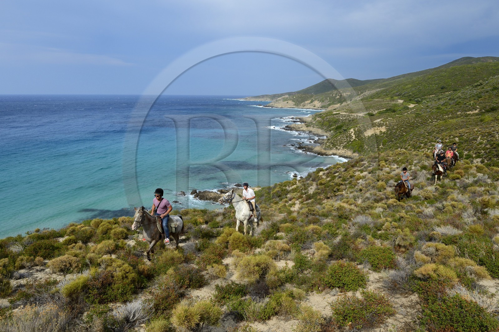 France, Haute Corse, Nebbio, Punta di l’Acciolu (Acciola), riders trekking in the Agriates Desert