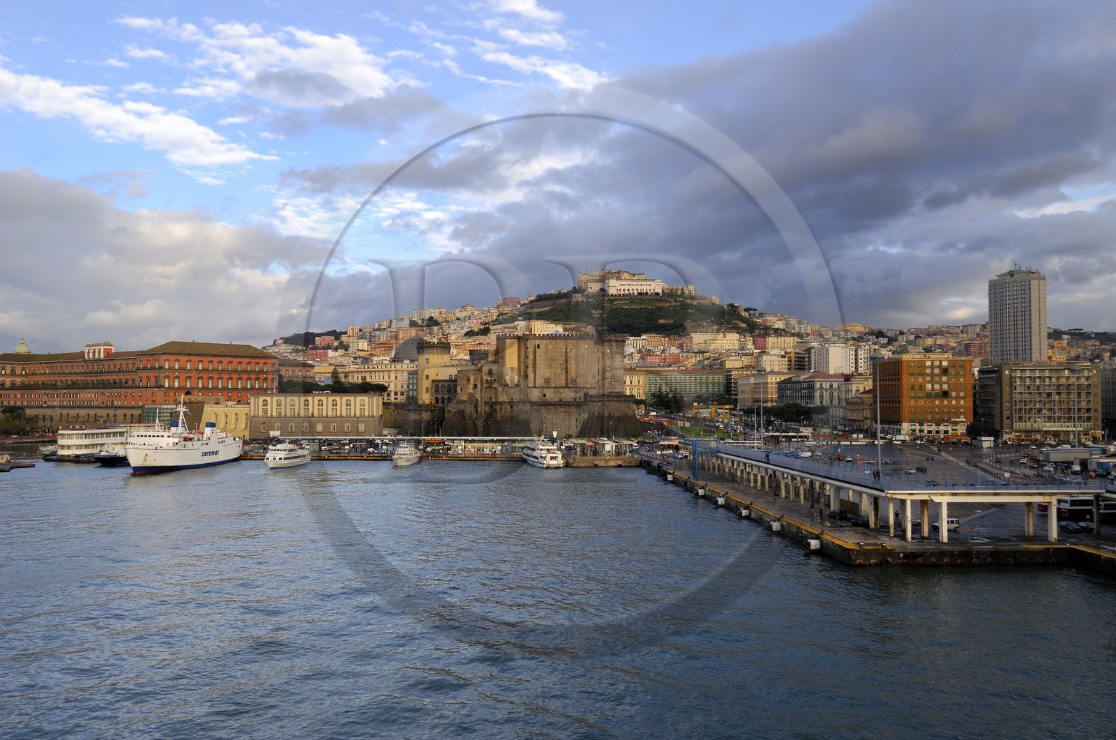 Italy, Campania, Naples, Historic center listed as World Heritage by UNESCO, Castel San Elmo on up side to Naples Hill, Palazzo Reale left, the Castel Nuovo in the center and the passenger port on the right