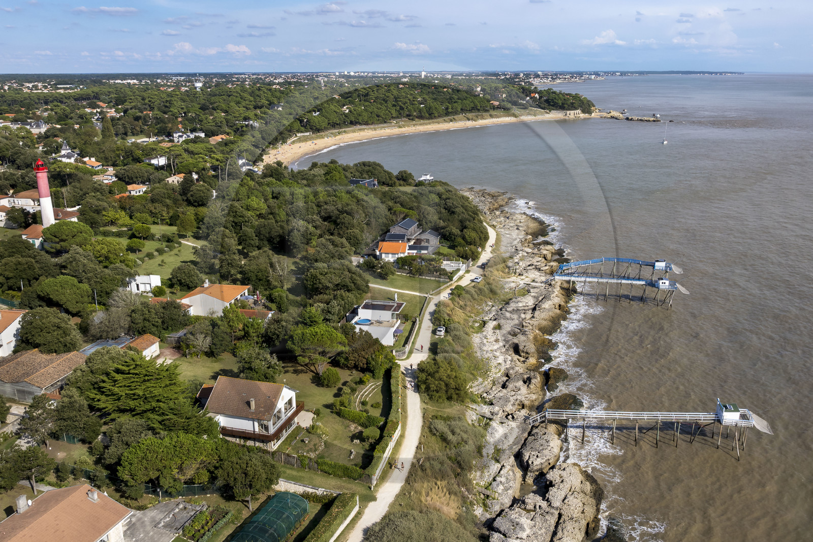 France, Charente-Maritime, Royan region, Saint Palais sur Mer, traditional carrelet (fishing shack) in fishing huts and the Terre-Nègre Lighthouse, customs officers' path which runs along the coast