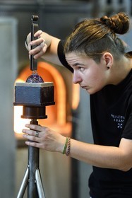 France, Moselle, Meisenthal, Centre international d'Art verrier (CIAV) (international glass centre), the blowing workshop, crafting a Christmas ball, finalization of the installation of the glass hook