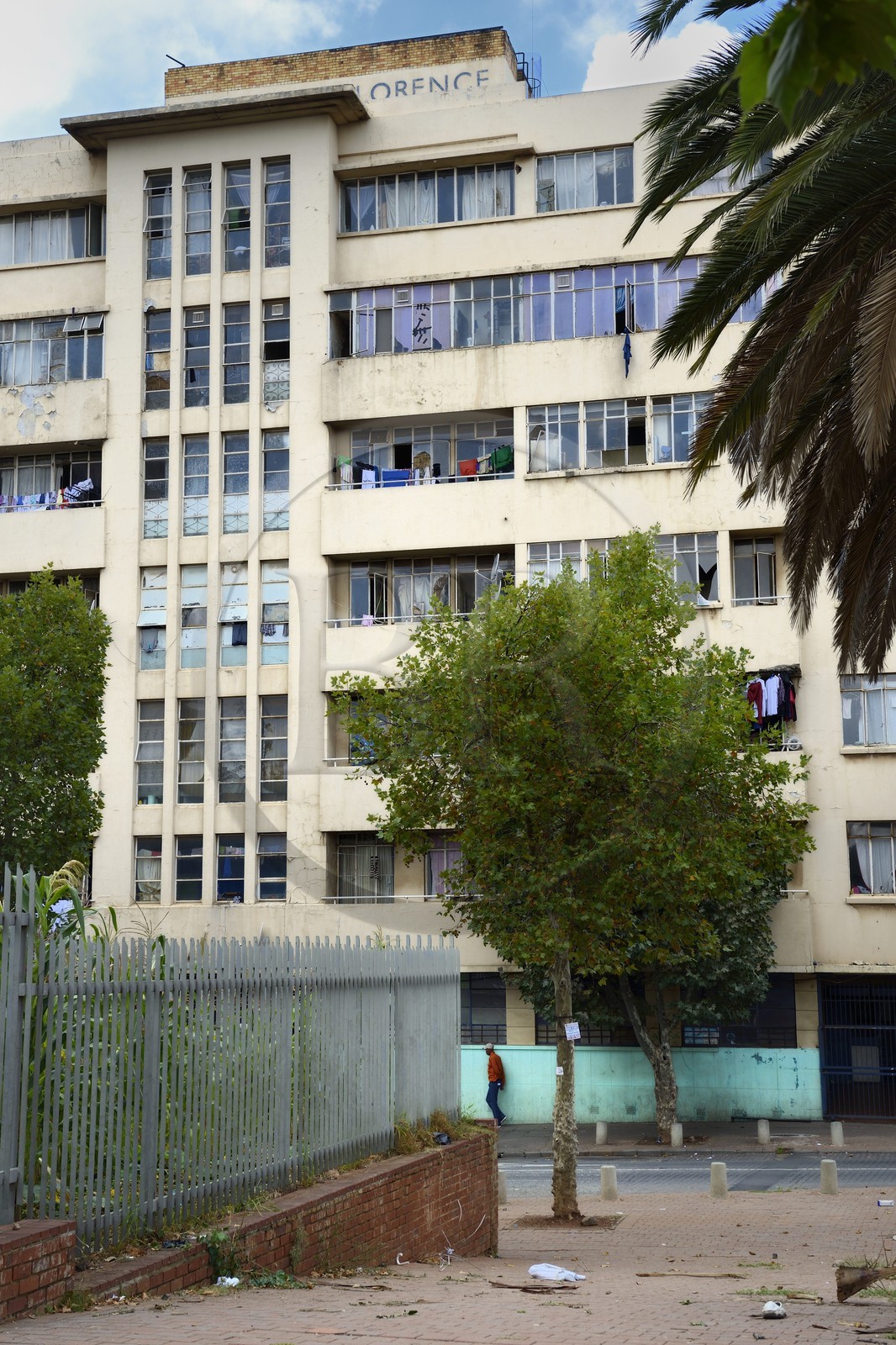 South Africa, Gauteng Province, Johannesburg, Hillbrow district, In the 1970s it was an Apartheid-designated Whites Only area but soon became a Grey Area, where people of different ethnicities lived together and is now known for its high levels of population density, unemployment, poverty and crime, building of the former Florence Nightingale Hospital today squatted