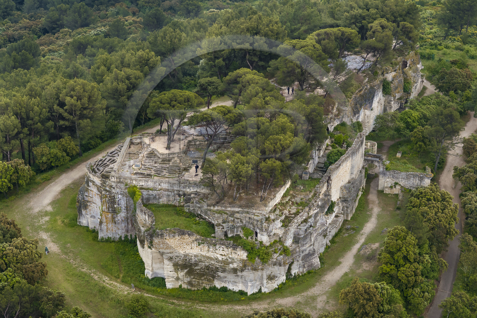 France, Gard, Beaucaire, troglodyte abbey of Saint-Roman, necropolis on the summit housing hundreds of tombs dug into the rock (aerial view)