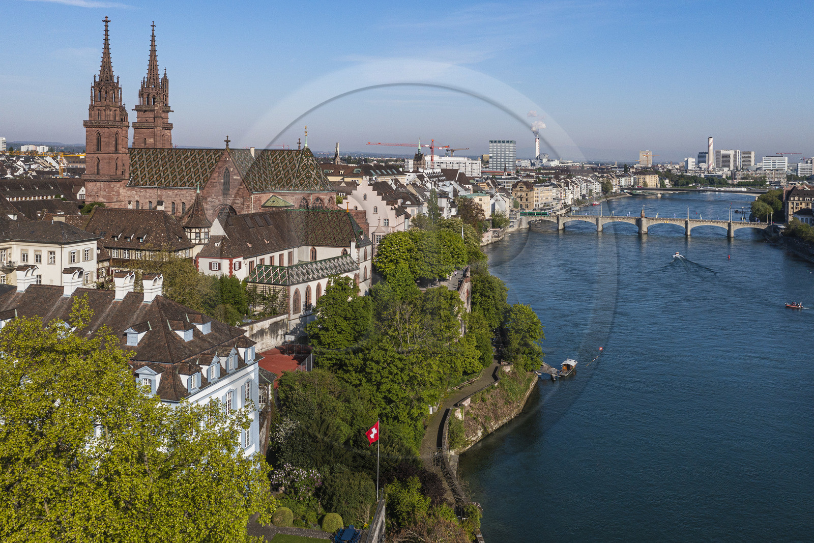 Switzerland, Basel, the left bank of the Rhine, the Minster or Protestant Cathedral of Our Lady of Basel (Munster) overlooking the Rhine, the Mittlere Brucke bridge in the background (aerial view)