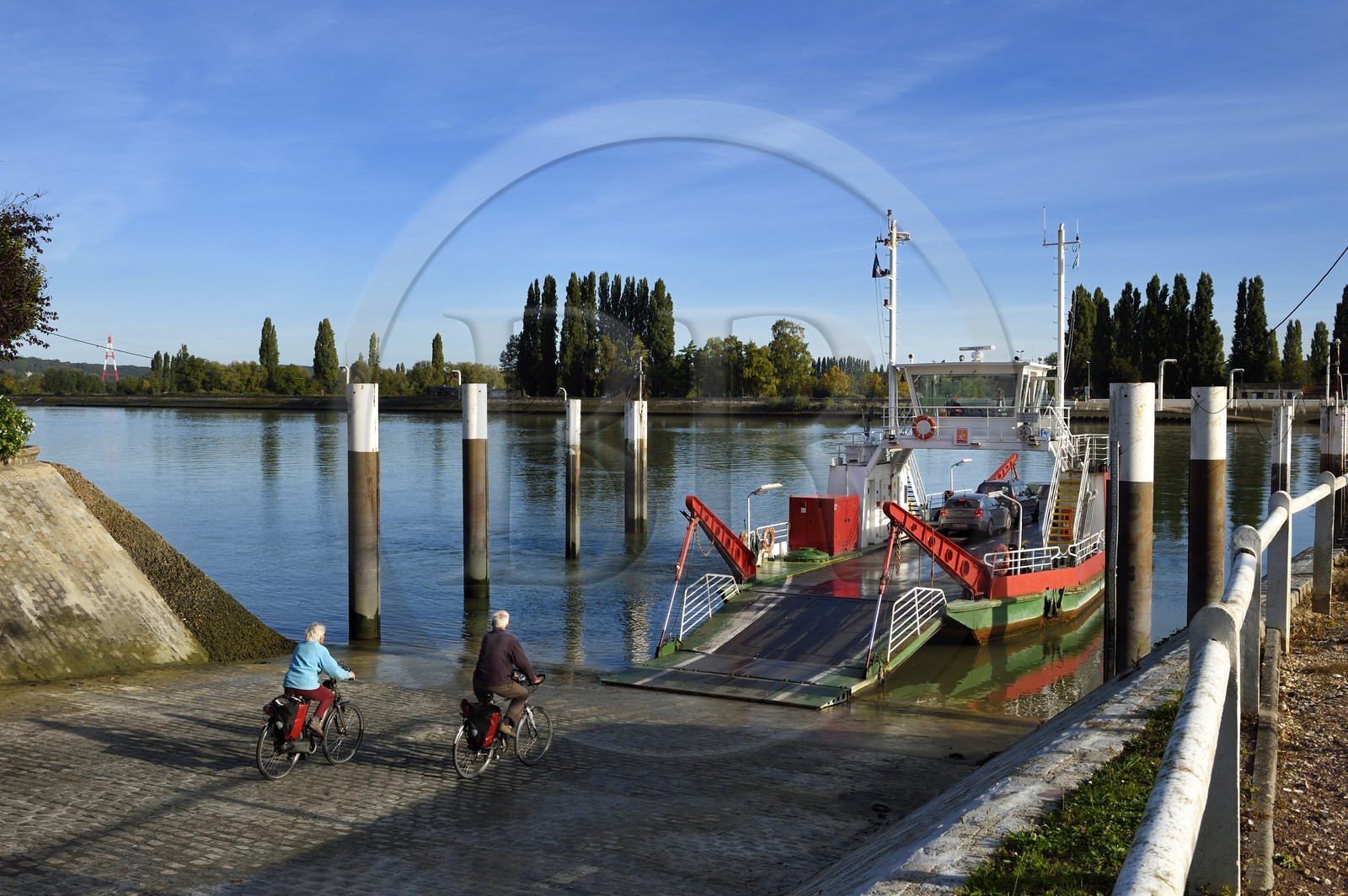 France, Seine-Maritime, Norman Seine River Meanders Regional Nature Park, the ferry crossing the Seine at the village of La Bouille, cyclists on the Veloroute of Val de Seine