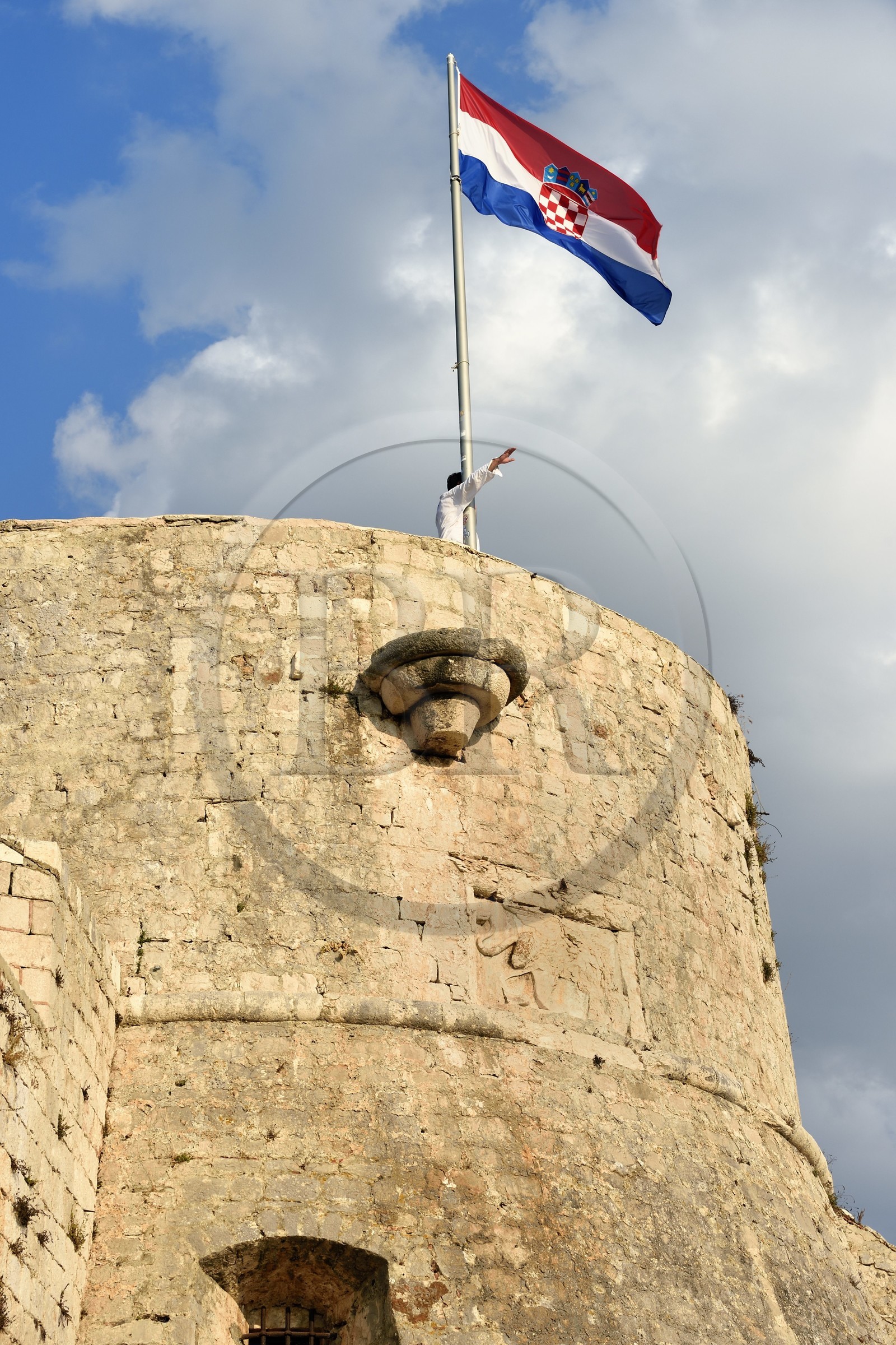 Croatia, Dalmatia, Dalmatian coast, Island of Hvar, the town of Hvar, the Croatian flag on the bastion of the Spanish Fortress