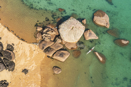 France, Cotes-d'Armor, Cote de Granit Rose, Trégastel, Renote island, kayak evolving in the middle of the granite chaos (aerial view)