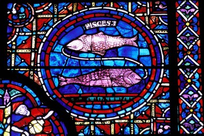 France, Eure et Loir, Chartres, Notre Dame de Chartres Cathedral listed as World Heritage by UNESCO, stained glass window with Pisces zodiac sign