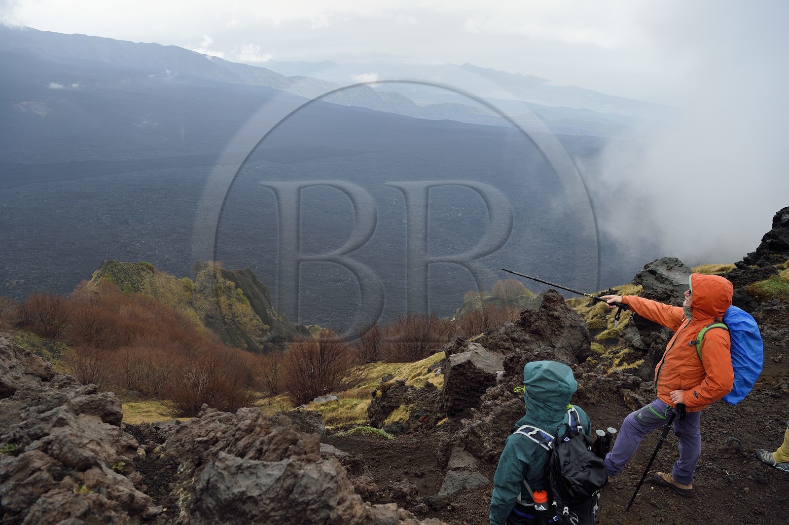 Italy, Sicily, Etna Regional Nature Park, Mount Etna, listed as World Heritage by UNESCO, hikers on the edge of the Valle del Bove which corresponds at a collapse of one of the walls of Mount Etna creating a field of volcanic rocks of 7 km by 6 km