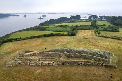 France, Finistère, Morlaix bay, Kernehelen peninsula, 6000 years old Cairn of Barnenez (aerial view)