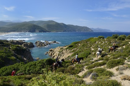 France, Haute Corse, Nebbio, Agriates Desert, Peraiola Cove, riders on the East of Ostriconi beach