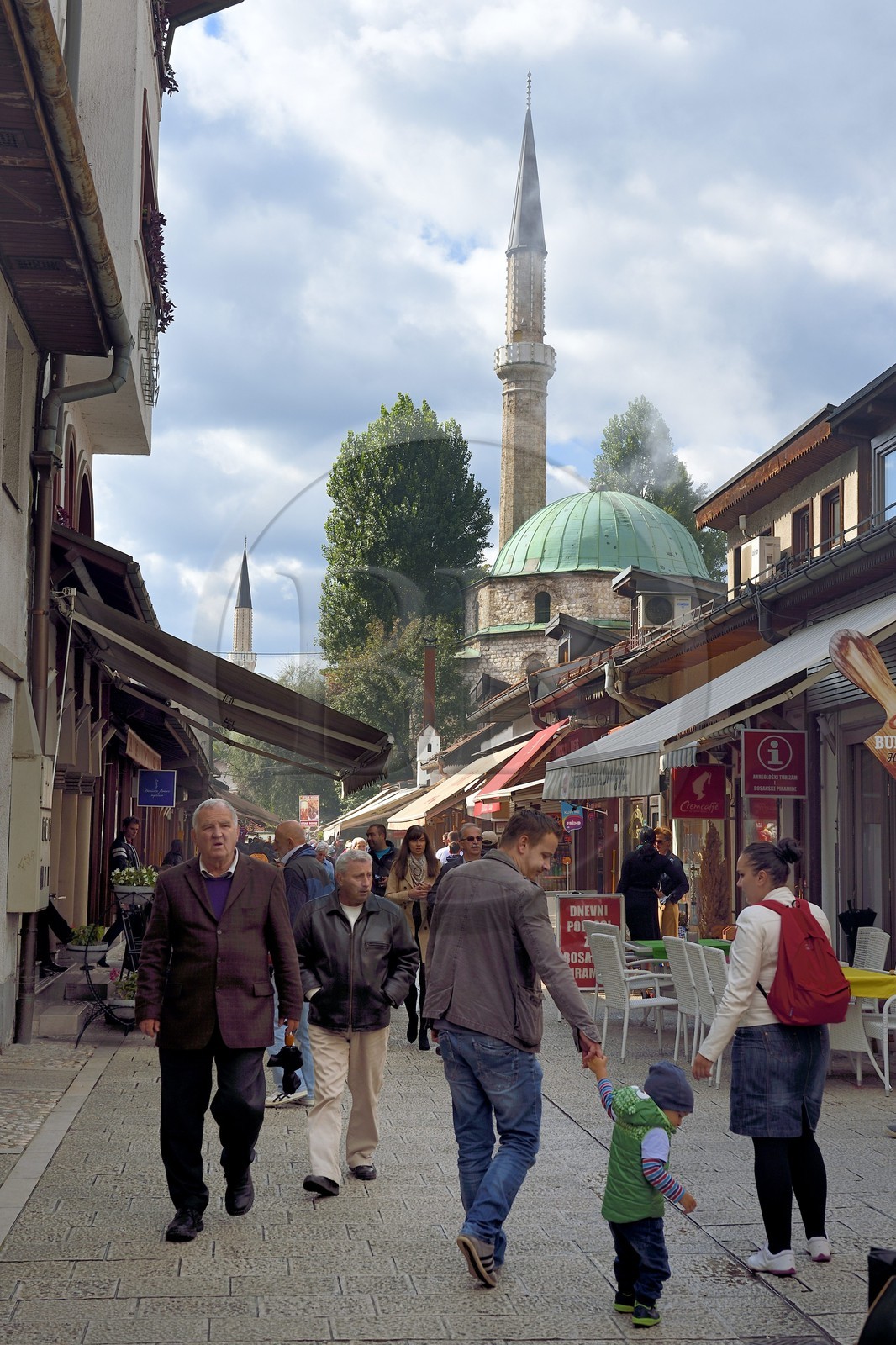 Bosnia and Herzegovina, Sarajevo, Bascarsija district in the old town, Bravadziluk street famous for its Burek and cevapi restaurants, Bascarsijska mosque (Bascarsijska dzamija) in the background