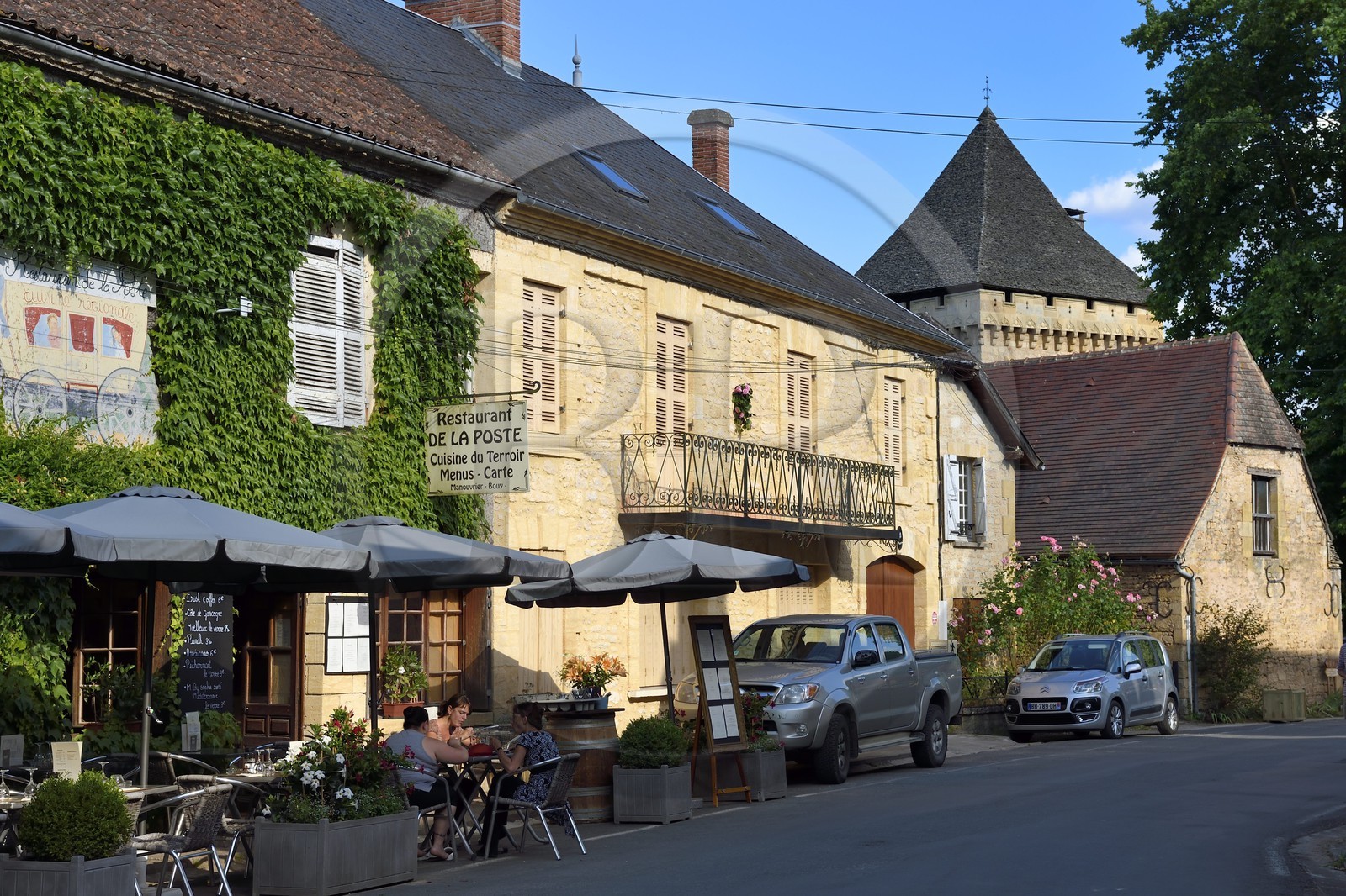 France, Dordogne, Perigord Noir, Vezere Valley, Saint Leon sur Vezere, labelled Les Plus Beaux Villages de France (The Most Beautiful Villages of France), the main street and the keep of the Manoir de la Salle Mansion in the background