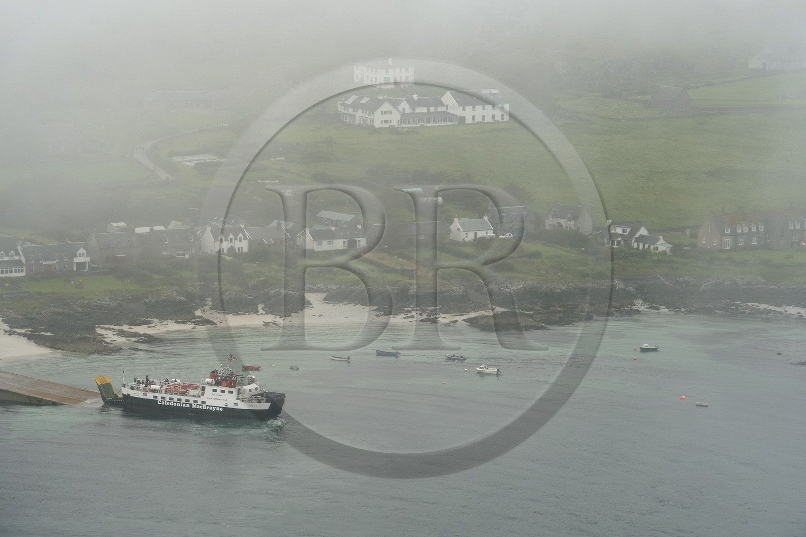 United Kingdom, Scotland, Highland, Inner Hebrides, Isle of Iona facing the Isle of Mull, ferry docking at Baile Mor (aerial view)