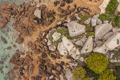 France, Cotes-d'Armor, Cote de Granit Rose, Trégastel, Renote island, hikers in the granite chaos (aerial view)
