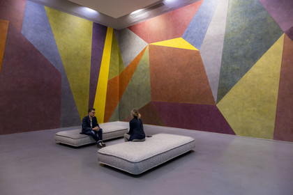 France, Vaucluse, Avignon, Collection Lambert, Museum of Contemporary Art, Wall Drawing 538: on four walls continuous form with color ink washes superimposed (1987) ink on wall by artist Sol LeWitt, Stéphane Ibars, artistic director of the Collection sitting on the sofa