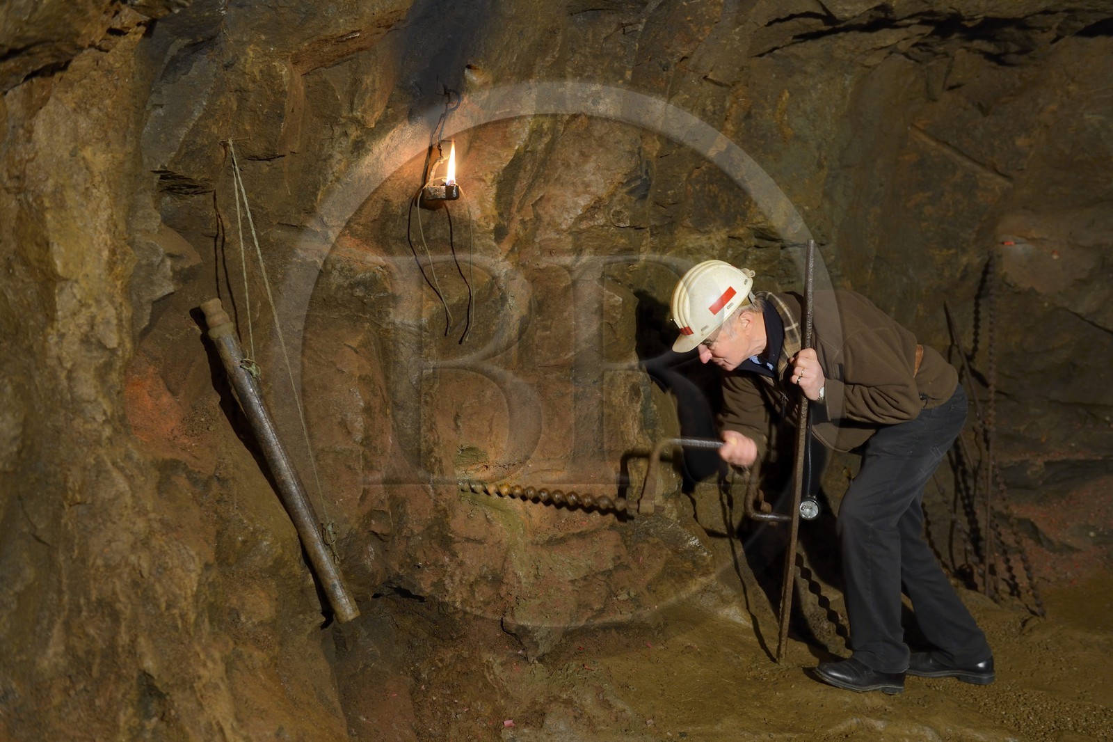 France, Moselle, Fensch Valley, Neufchef, Antoine Bach spent 36 years underground as miner chief in the galleries of the old iron mine of Hayange, drill a hole to put the powder and make the rock explode
