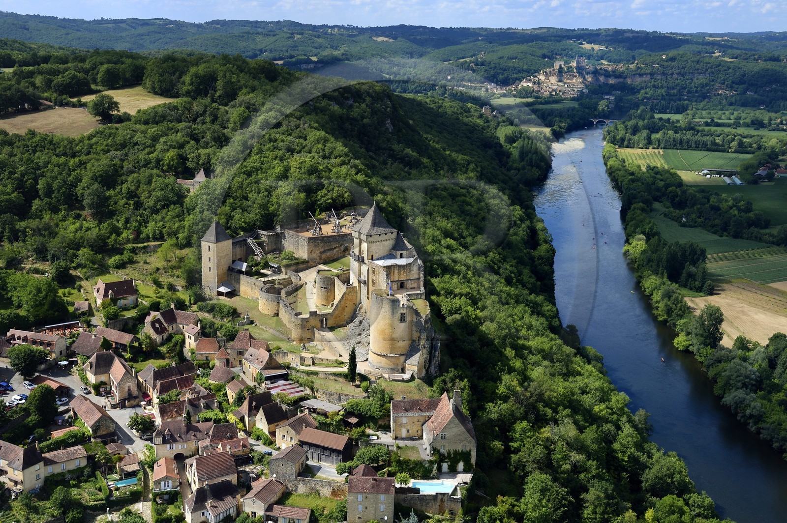 France, Dordogne, Perigord Noir, Dordogne Valley, Castelnaud la Chapelle, labelled Les Plus Beaux Villages de France (The Most Beautiful Villages of France), Castelnaud Castle on a cliff above the Dordogne valley (aerial view)