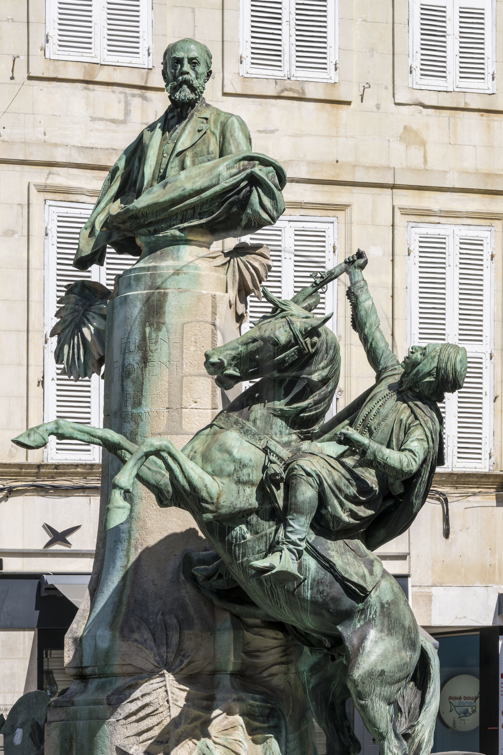 France, Charente Maritime, La Rochelle, Place des Petits Bancs, bronze bust of the orientalist painter and writer Eugène Fromentin (1820-1876) and equestrian statue of an Arab fantasia, group made in 1905 by the sculptor Ernest Dubois