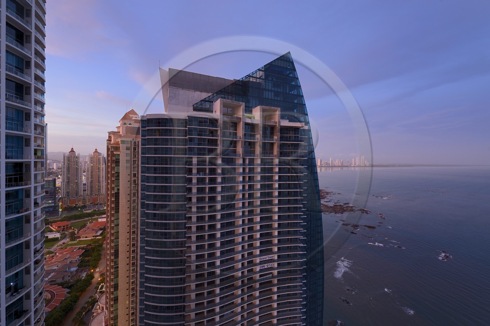 Panama, Panama City, Grand Tower building and the new district of skyscrapers at Costa del Este in the background