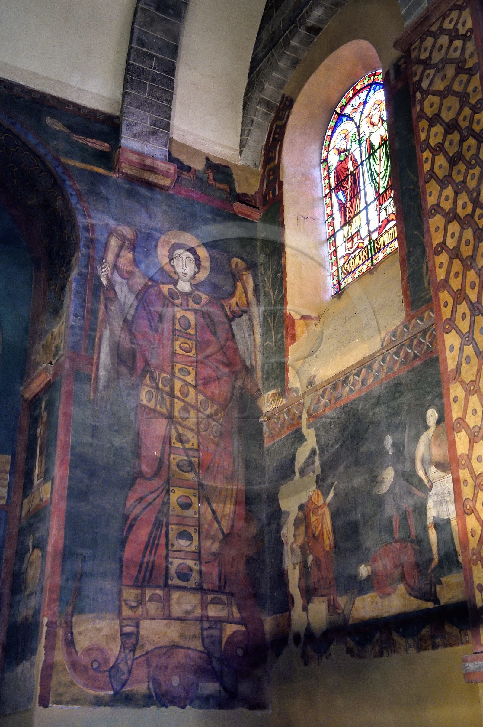 France, Haute Loire, Le Puy en Velay, Routes of Santiago de Compostela, the 12th century Our Lady (Notre-Dame-de-l'Annunciation) cathedral listed as World heritage by UNESCO, north gallery, representation of the Archangel Saint-Michel from the second half of the 11th century (tallest full-length Saint of the Romanesque period with his 6 meters)