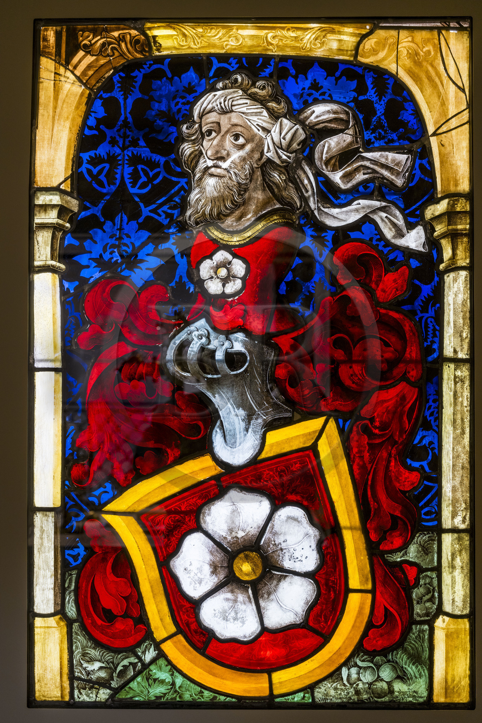 France, Paris, Musée de Cluny - Musée national du Moyen-Age (Middle Ages Museum in the former Hotel de Cluny), stained glass window representing the arms of the Mullenheim family, donor in prayer, Upper Rhine (Alsace), early 16th century