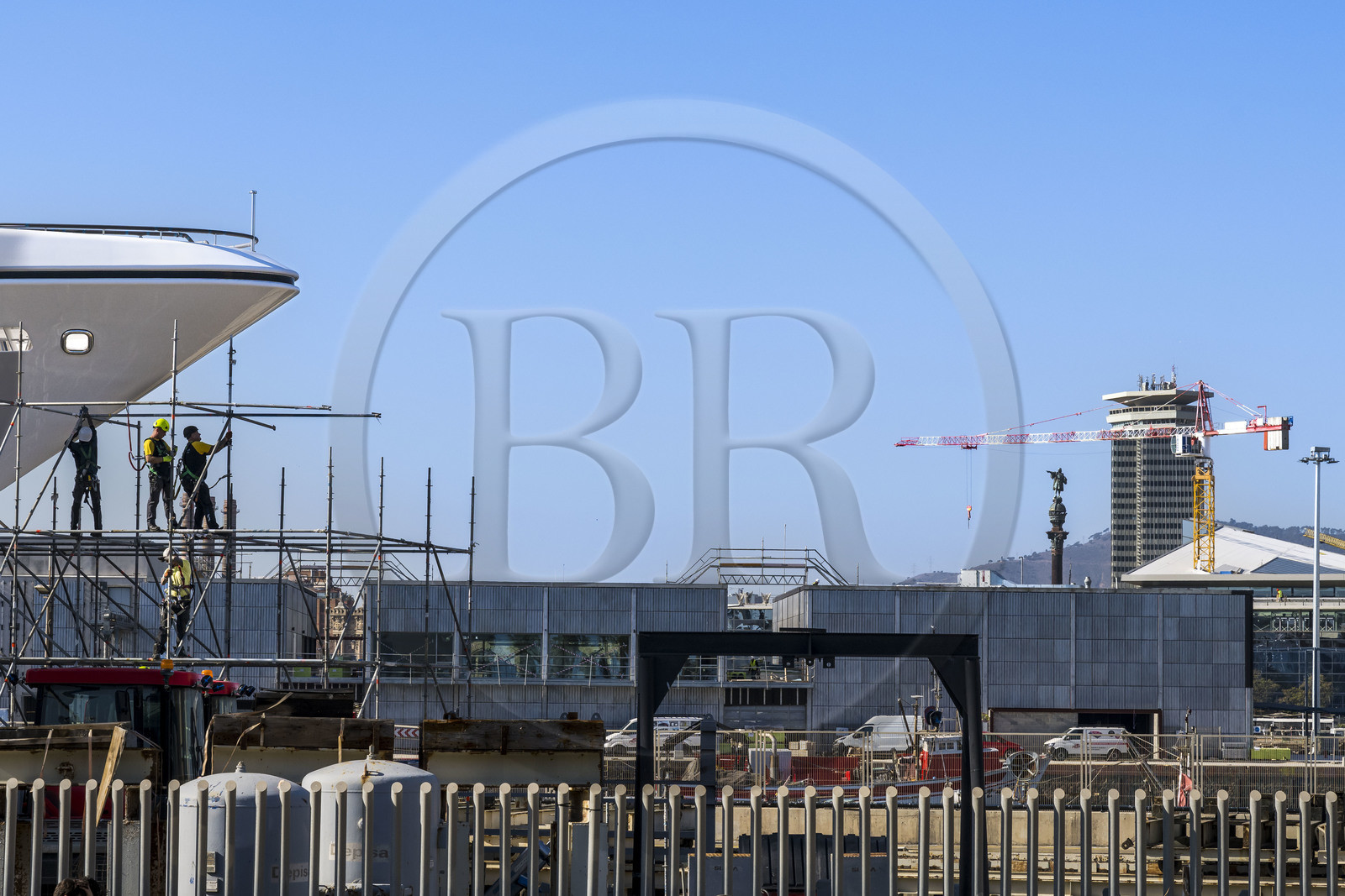 Spain, Catalonia, Barcelona, La Barceloneta, Port Vell, shipyard and the Christopher Columbus column in the background