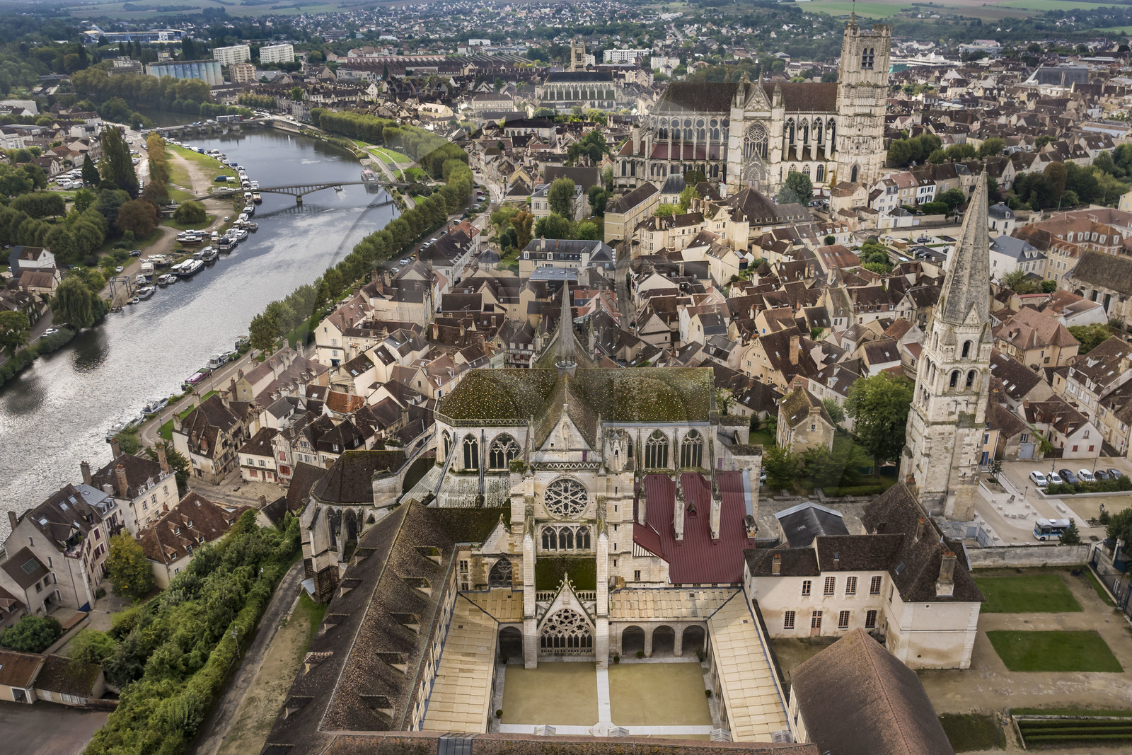 France, Yonne, Auxerre, Saint Germain Abbey and its cloister overlooking the Marine district, Saint Etienne Cathedral in the background (aerial view)