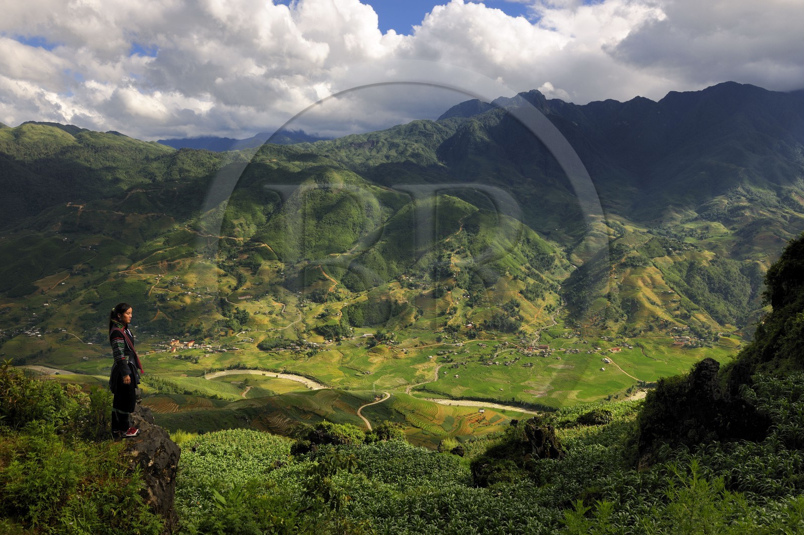 Vietnam, Lao Cai province, Sapa district, young woman from the Black Hmong minority group overlooking her valley Hau Thao