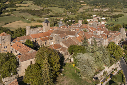 France, Aveyron, Causses and the Cévennes, cultural landscape of Mediterranean agro-pastoralism, listed as World Heritage by UNESCO, Sainte-Eulalie-de-Cernon, Templar Commandery then Hospitaller Commandery of the Order of Saint John of Jerusalem in the foreground (aerial view)
