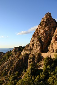 France, Corse du Sud, Golfe de Porto, listed as World Heritage by UNESCO,  the Creeks of Piana (Calanches de Piana) with pink granite rocks and the D81 road between Porto and Cargese