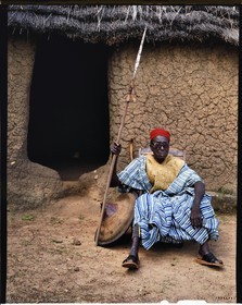 Burkina Faso, Poni province, Lobi land, Loropéni region, The King of the Gans (now deceased) in the village of Obire, he poses here in his dress suit with golden thread but without his horse who died ten years before and that he did not have the money to replace