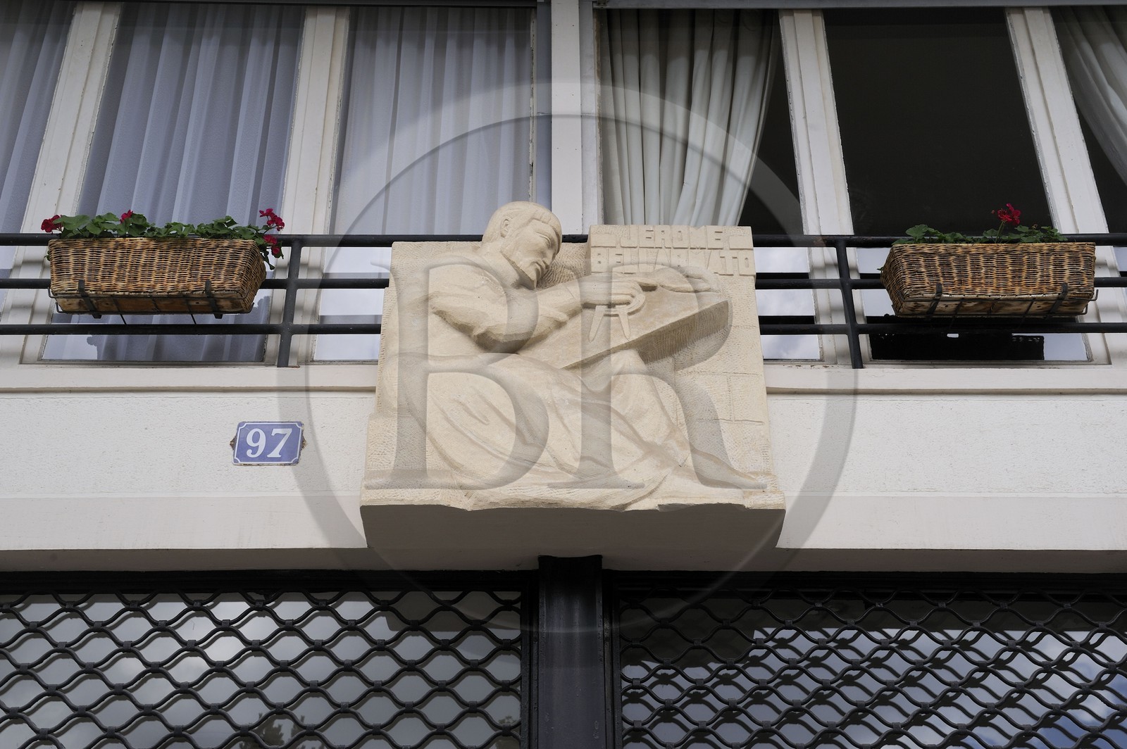 France, Seine Maritime, Le Havre, Downtown rebuilt by Auguste Perret listed as World Heritage by UNESCO, Perret buildings of the Avenue Foch, building called the Builders customized by this sculpture