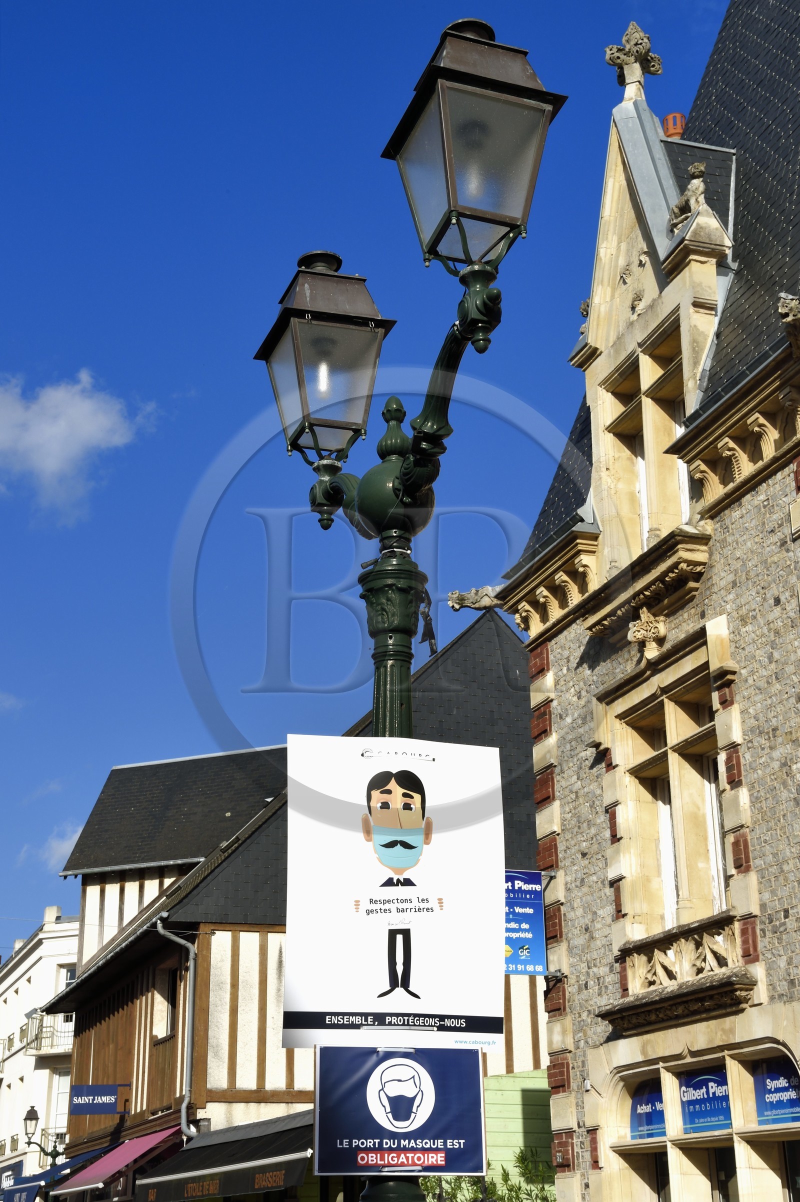 France, Calvados, Pays d'Auge, the cote Fleurie (Flowered coast), Cabourg, panel encouraging to wear the mask against Covid-19 in the street