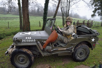 France, Eure, Sainte Colombe prés Vernon, Allied Reconstitution Group (US World War 2 and french Maquis historical reconstruction Association), reenactor in uniform of the 101st US Airborne Division driving a en jeep Willys