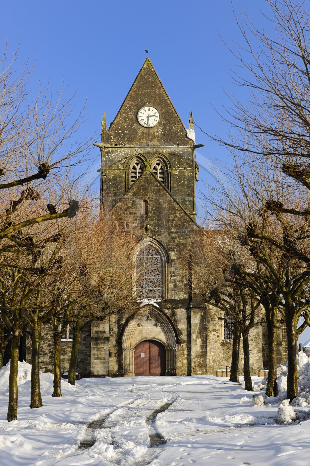 France, Manche, Cotentin, parachutist's dummy hanging on the church's bell tower of Sainte Mere Eglise