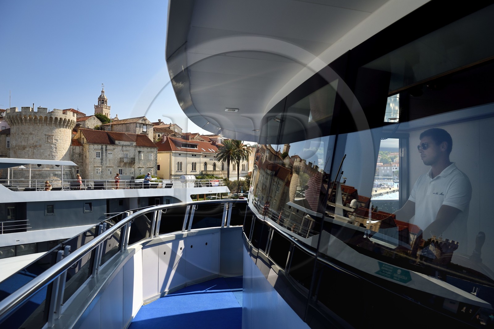 Croatia, Dalmatia, Dalmatian coast, Korcula Island, Korcula Town, arrival at the port of cruise ship Ave Maria, its captain Rade Naranca in the wheelhouse