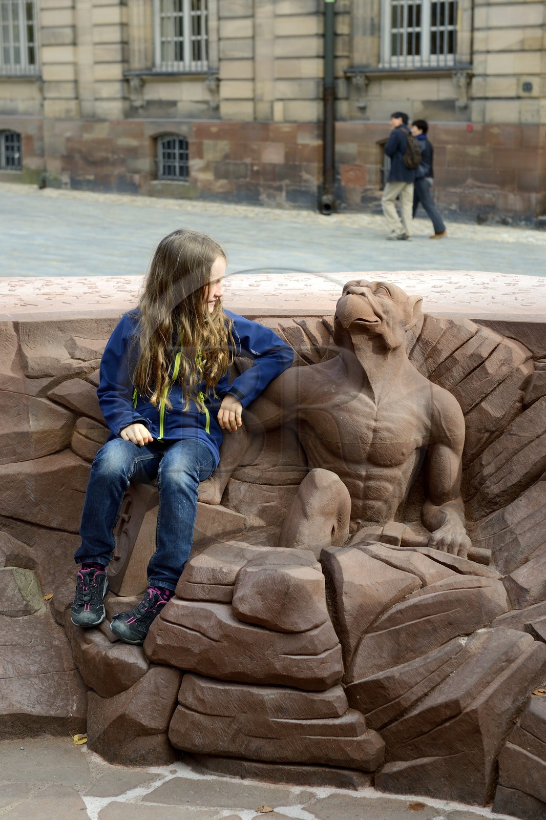 France, Bas Rhin, Strasbourg, old town listed as World Heritage by UNESCO, place du Chateau, chimera extracting from the stone with the look pointed towards the top of the Cathedral