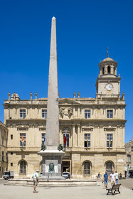 France, Bouches du Rhone, Arles, place de la République, the clock tower of the Town Hall, the obelisk fountain, the obelisk is the last vestige of the ancient circus which was located further west
