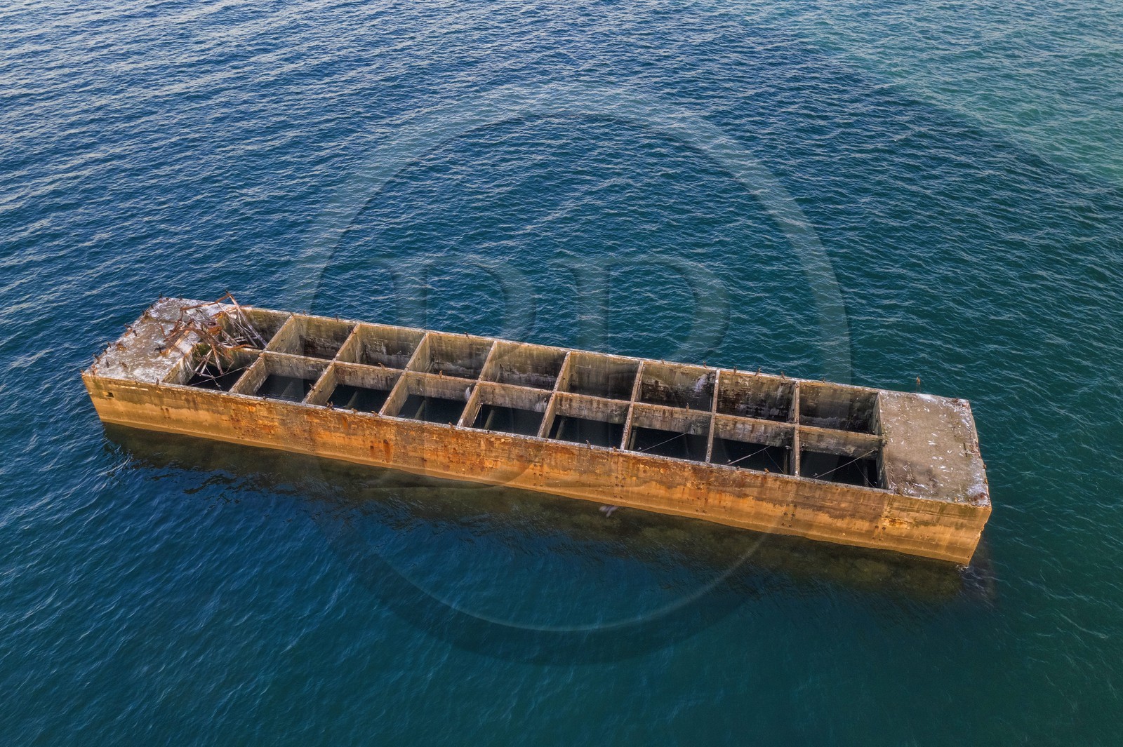 France, Calvados, Arromanches les Bains, cliffs of Cap Manvieux, Mulberry B remains, Port Winston, Phoenix breakwaters (aerial view)