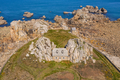 France, Cotes-d'Armor, Cote d'Ajoncs, Plougrescant, site of the Plougrescant Gouffre, the small house of Castel Meur, any representation for commercial use of this house is prohibited (aerial view)