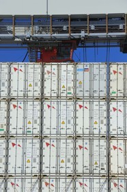 France, Seine Maritime, Le Havre, commercial port, container ship in the Rene Coty docking basin and crane transhipping containers