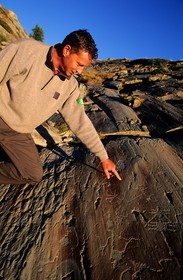 France, Alpes Maritimes, Mercantour National Park, Vallee des Merveilles near Fontanalbe, cave engravings on the Sacred Way (1800 1500 B.C.) shown by the park guard Yannick Bielle