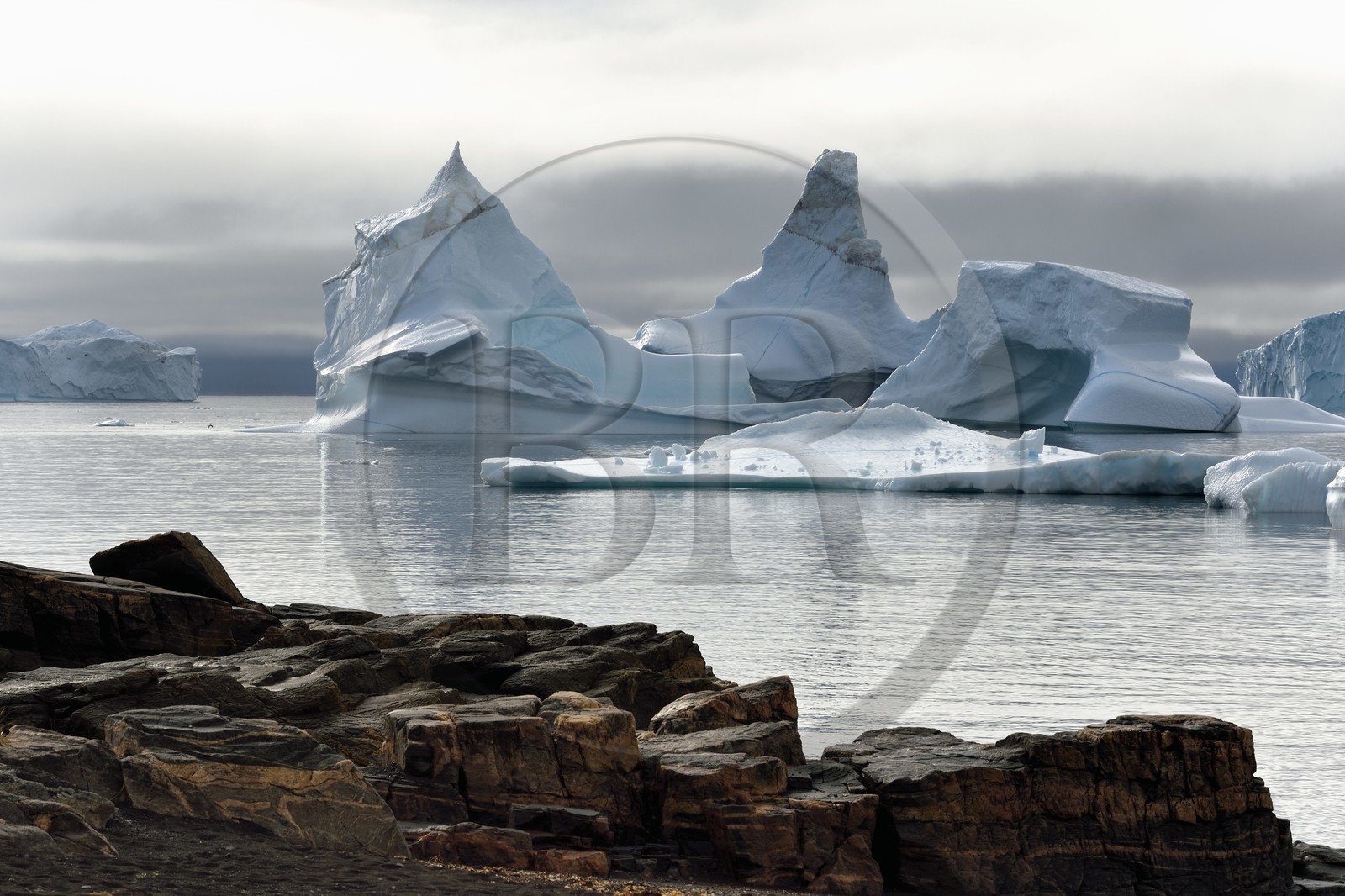 Greenland, west coast, Disko Island, Qeqertarsuaq village bay, icebergs in the mist